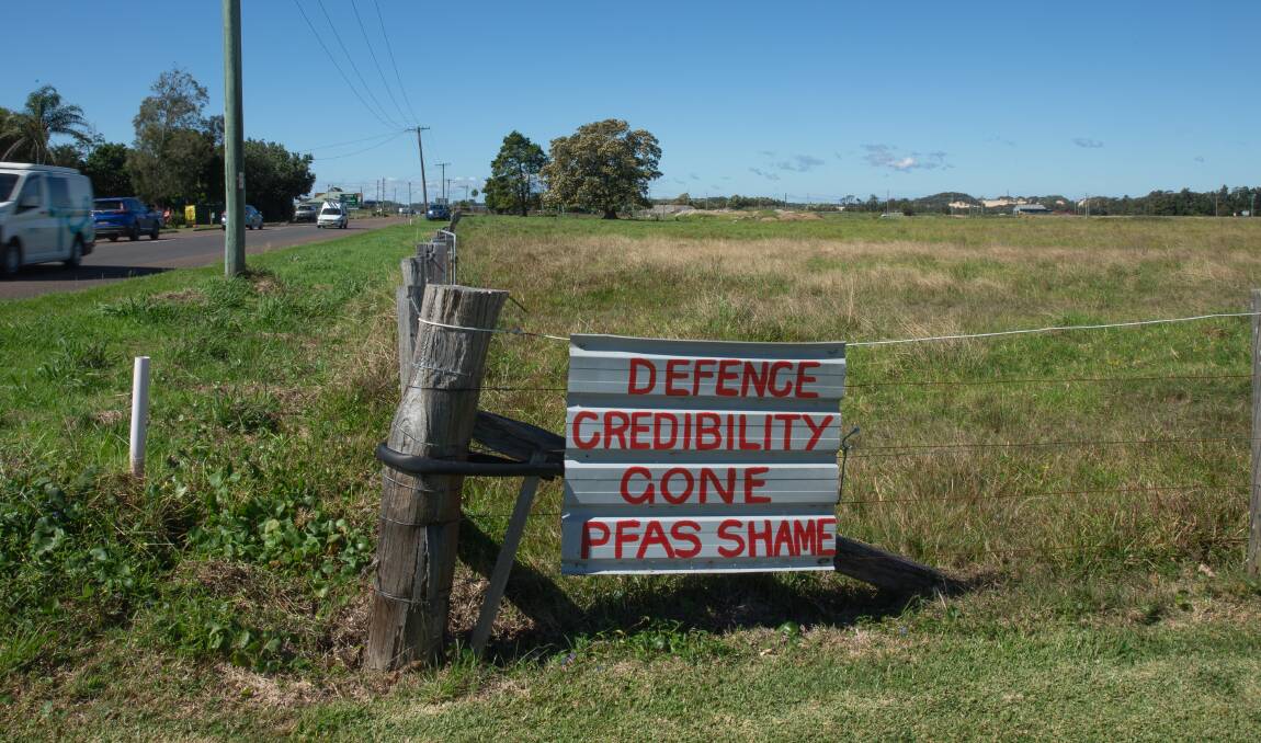 A sign attached to the corner of the Robinson's property.