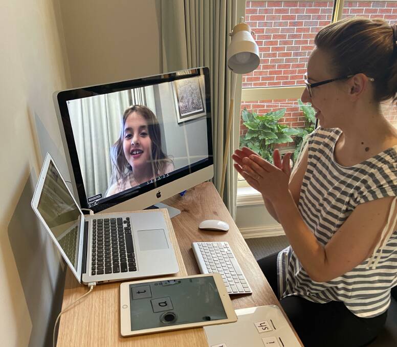 TUNING IN: Dynamic Kids team leader Brianna Edgar practises telehealth with her daughter Chloe as the clinic adapts amid pandemic restrictions.