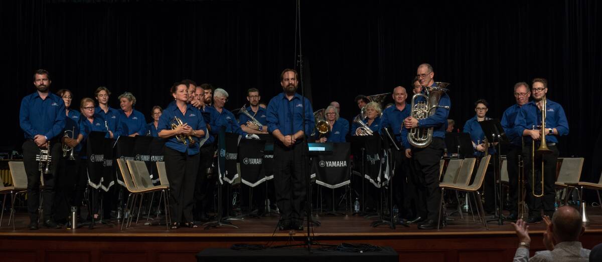 TAKE A BOW: Toronto Brass rises to the applause after performing at the Australian Band Championships, in Brisbane, at Easter. 