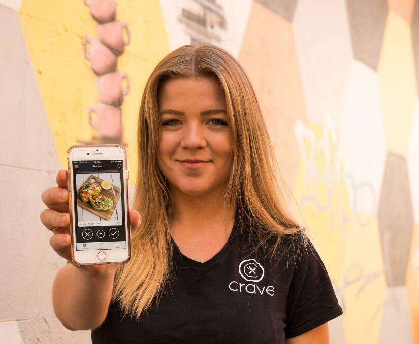 SWIPE RIGHT: Jessica Koncz with her new app she developed called Crave. The app is set to line up customers with the perfect dish. 