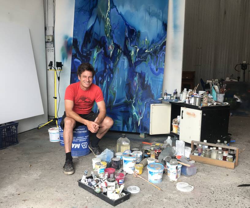 SUBLIME: Doug Heslop in his Hamilton North studio, pictured with a large scale work which captures his love of the ocean. Picture: Melinda McMillan