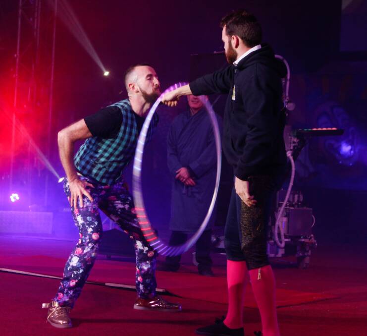 RECORD BREAKER: Simon Tarrant setting the world record for the most number of rotations of a hula hoop on a beard. Pictures: Catherine Forbes