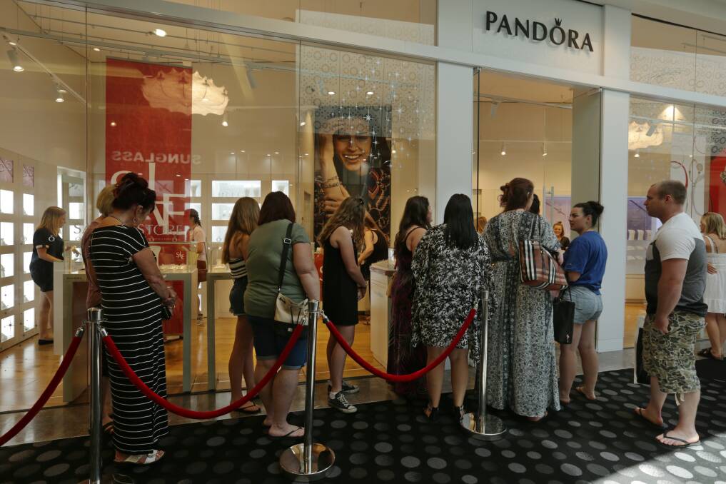 GOING CHEAP: People lining up for the Boxing Day sales at Westfield Kotara. Picture: Simone De Peak