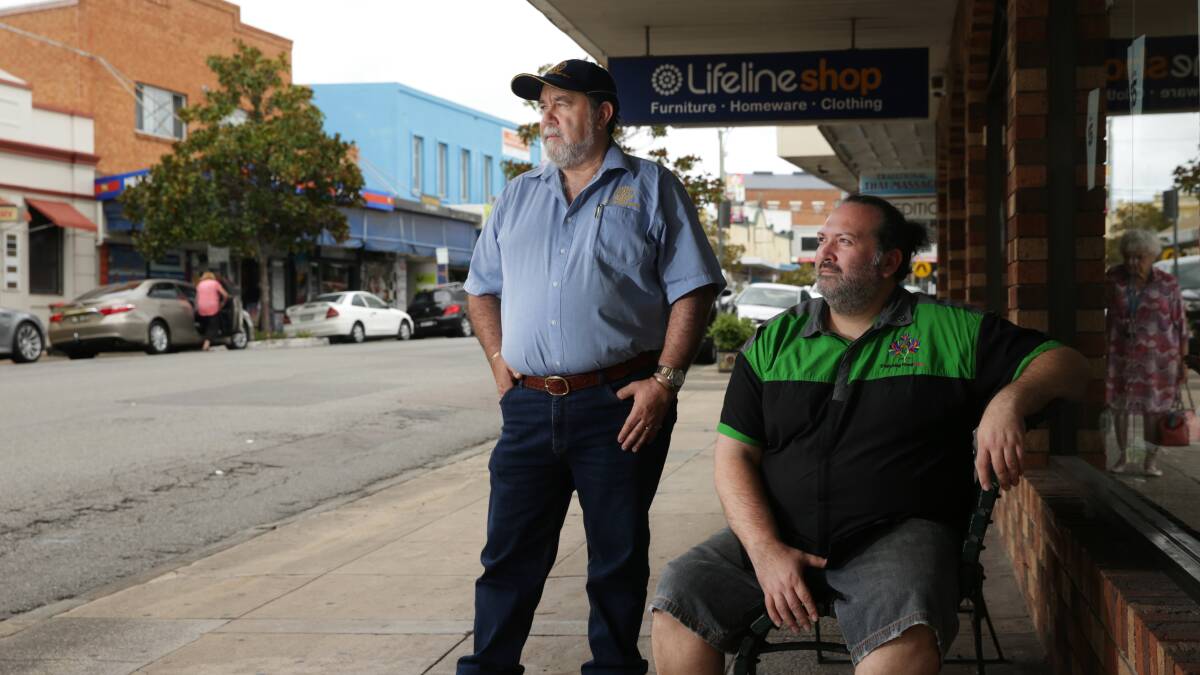 CONCERNED: Business owner Alyn Miranda, right, and Philip Gorton, graffiti removal co-coordinator for the Wallsend-Mayfield Rotary Club, are frustrated with a spike in petty crime in Wallsend. Pictures: Simone De Peak