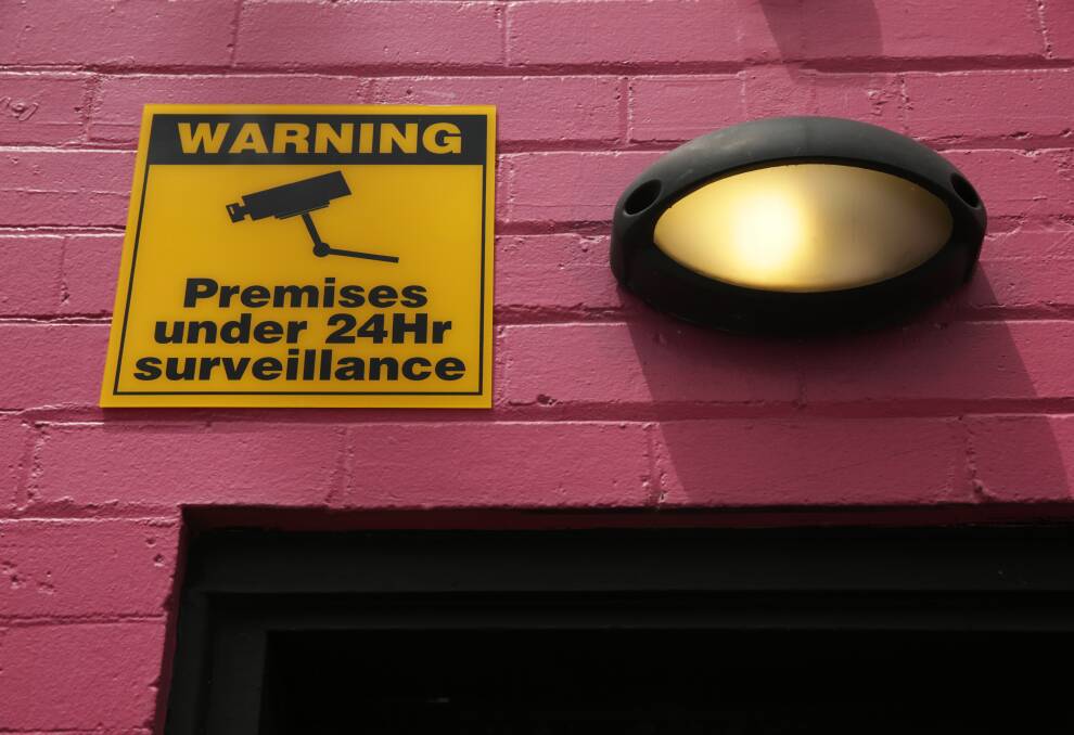 WATCHING AND WAITING: A sign to warn would-be thugs of a surveillance camera on Council Street.