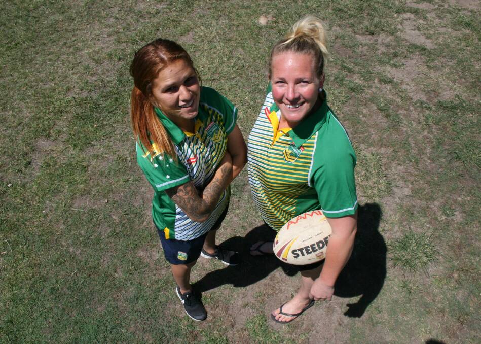 LOOKING UP: Newcastle-based World Cup champions Caitlin Moran and Bec Young welcome the NRL Women's Premiership. Picture: Josh Callinan