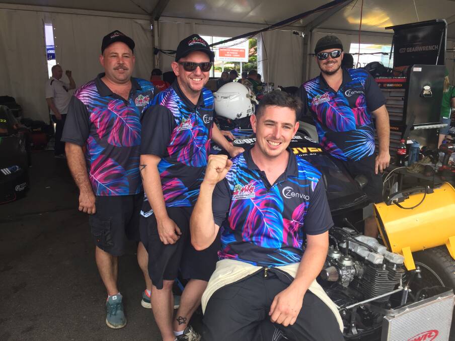CHALLENGE: Merewether driver Cody McKay (front) with his team in pit lane on Sunday following his Newcastle 500 debut in the Aussie Racing Cars. Picture: Josh Callinan
