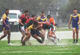 Western Suburbs players defending in heavy rain at Cahill Oval on Saturday. Picture by Peter Lorimer