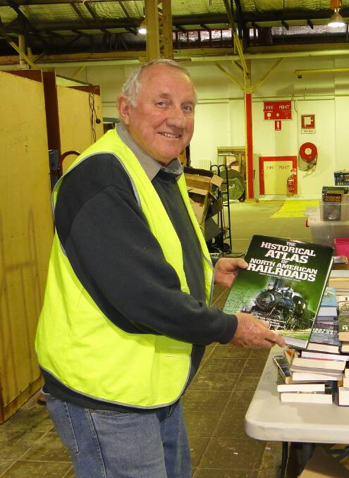 KIND WORK: Books 4 Outback organiser Ross Lane sorts donations.
