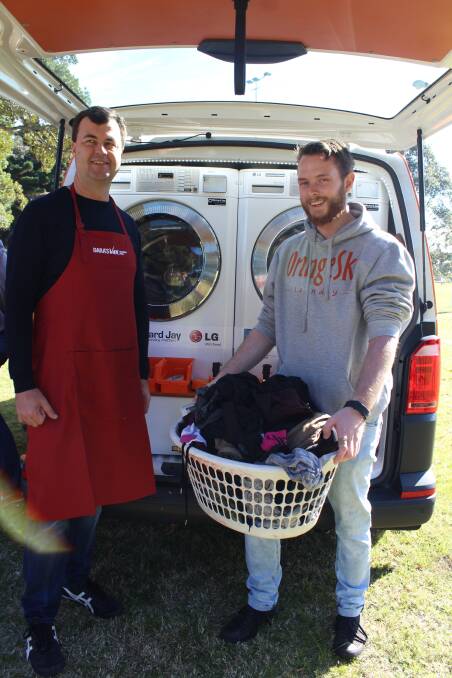 DARA spokesperson Sean Scanlon, left, with Orange Sky Laundry volunteer Jack Tearle.