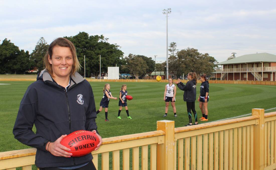 STRONG OUTLOOK: Newcastle City player Kate Handley, who also coaches the Blues under-12 girls' team, has fallen in love with the sport of AFL.