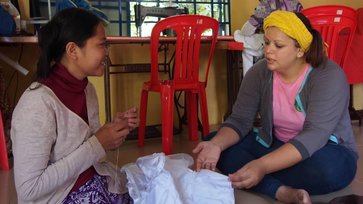 REWARDING: Newcastle's Sally Hetherington, right, is moving on after working in Cambodia for the past four years with Human and Hope Organisation.