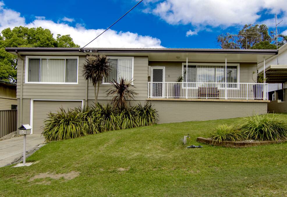 It has a family friendly yard and is close to schools, shops and public transport.