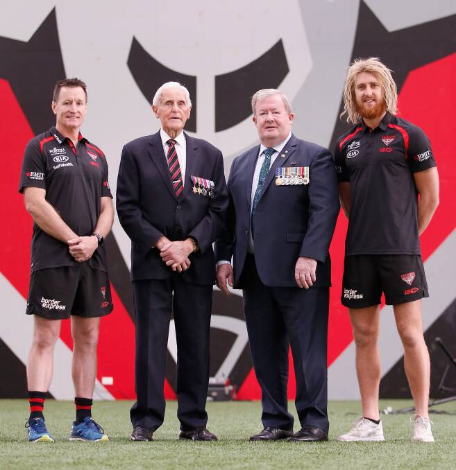 War veteran and Essendon ambassador Jack Jones (middle left) passed away on March 24 after being diagnosed with cancer in December. He is pictured here with (from left) John Worsfold, Senior Coach of the Bombers, Pete Smith OAM and Dyson Heppell of the Bombers at an ANZAC ceremony in 2018 in Melbourne. Picture by Darrian Traynor/Getty Images.