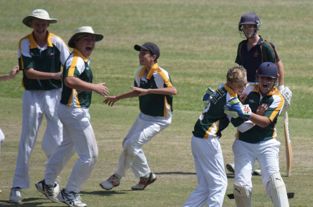 WINNERS: St Philip's Christian College Cessnock players celebrate a wicket in the final against Macquarie Anglican Grammar School at Mulbring last Tuesday. Picture: Andy Hall
