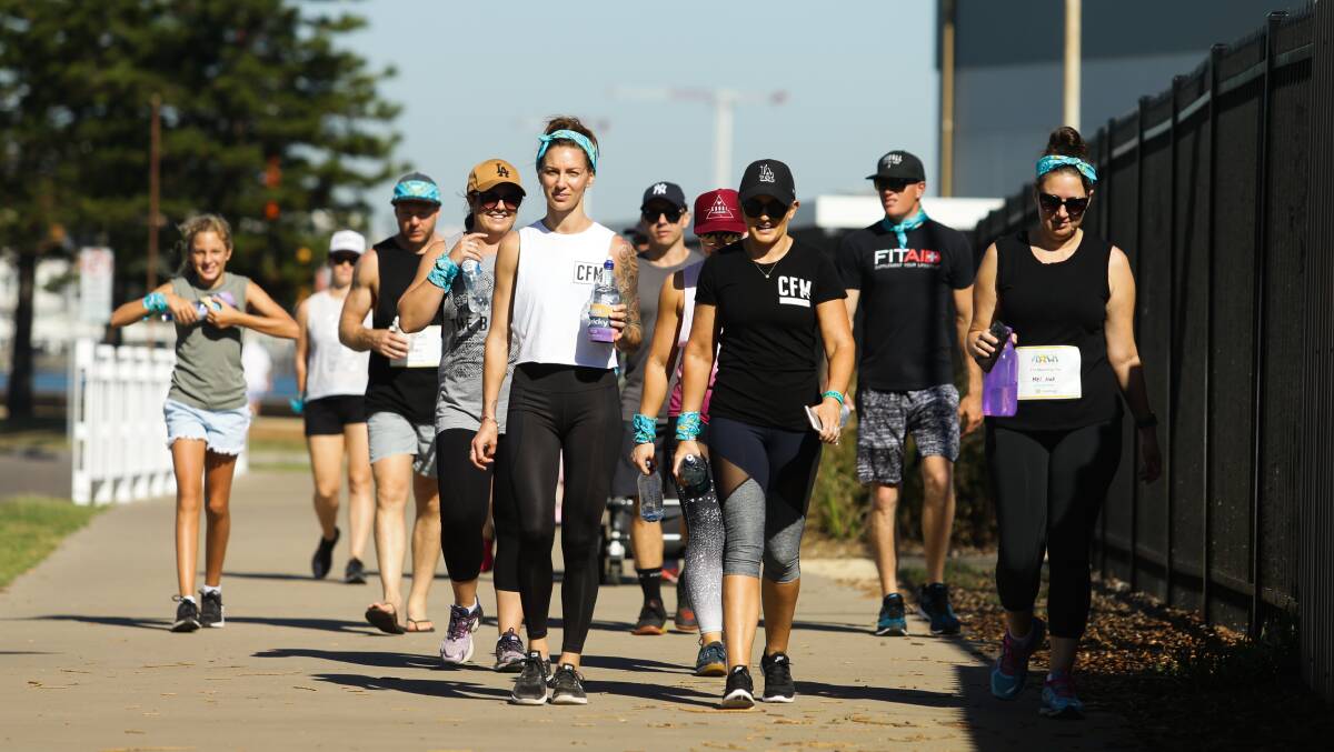 TOGETHER: A group of participants make their way down Newcastle Foreshore. Picture: Jonathan Carroll.