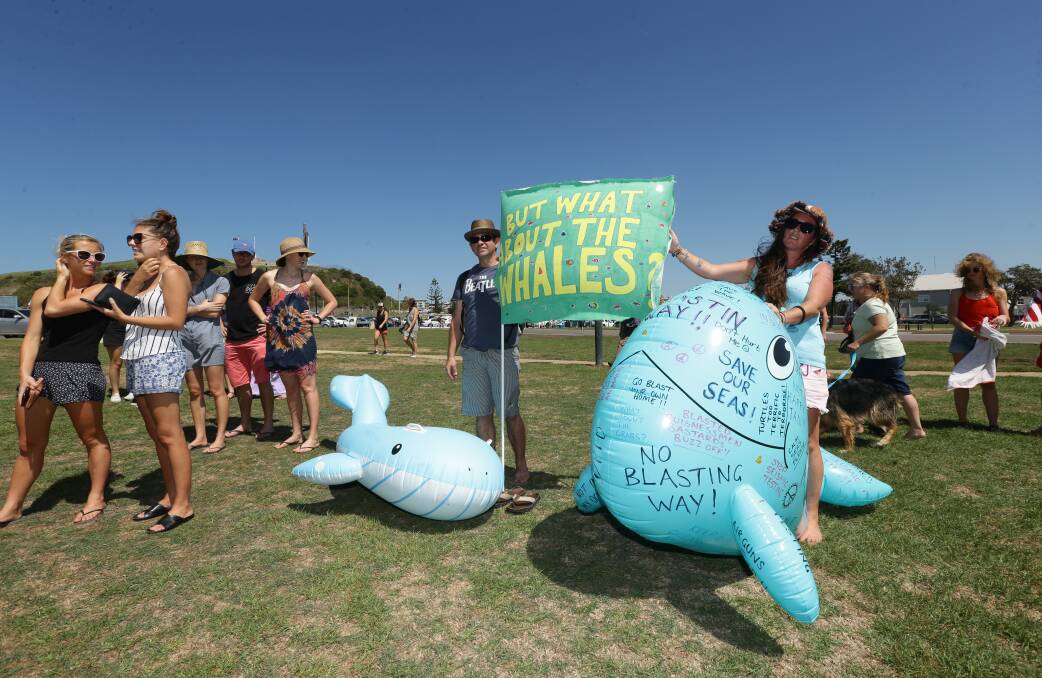 STRONG SIGN: Protesters on Sunday at Nobbys beach rallying against seismic testing to be conducted off Newcastle and the Central Coast. Picture: Jonathan Carroll.  