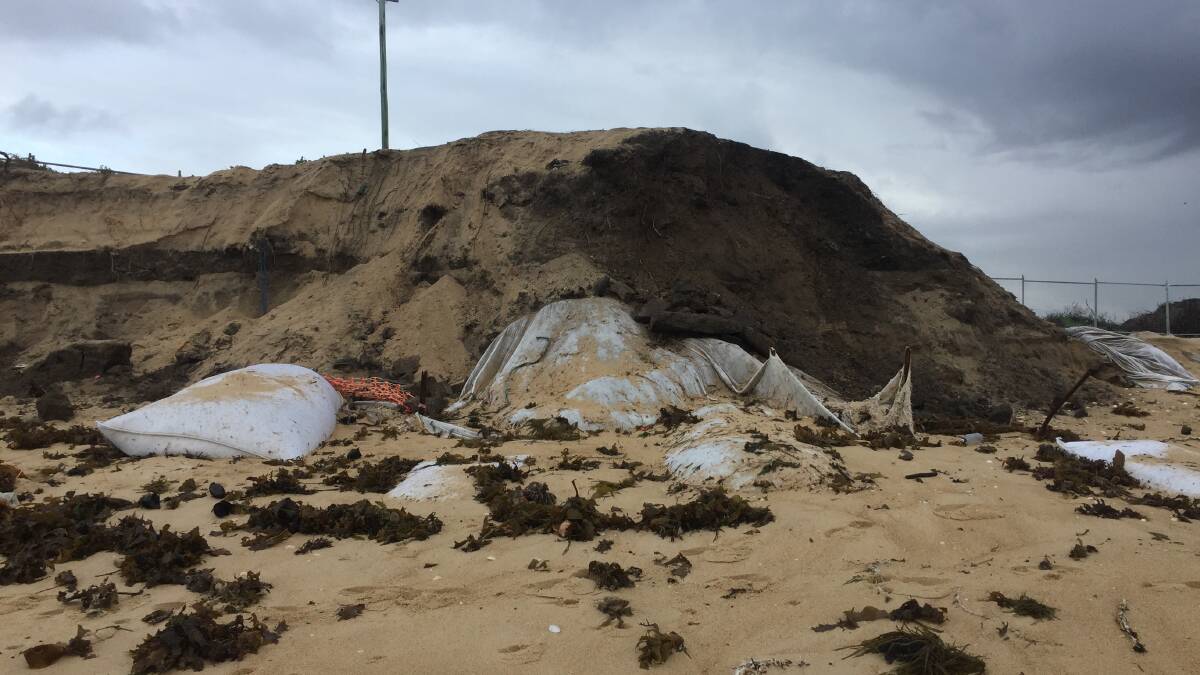 Liability: Hunter Water initially placed geofabric over a section of the former Stockton tip site on Crown Land. The geofabric was recently torn off in heavy swell. Picture: Matthew Kelly 