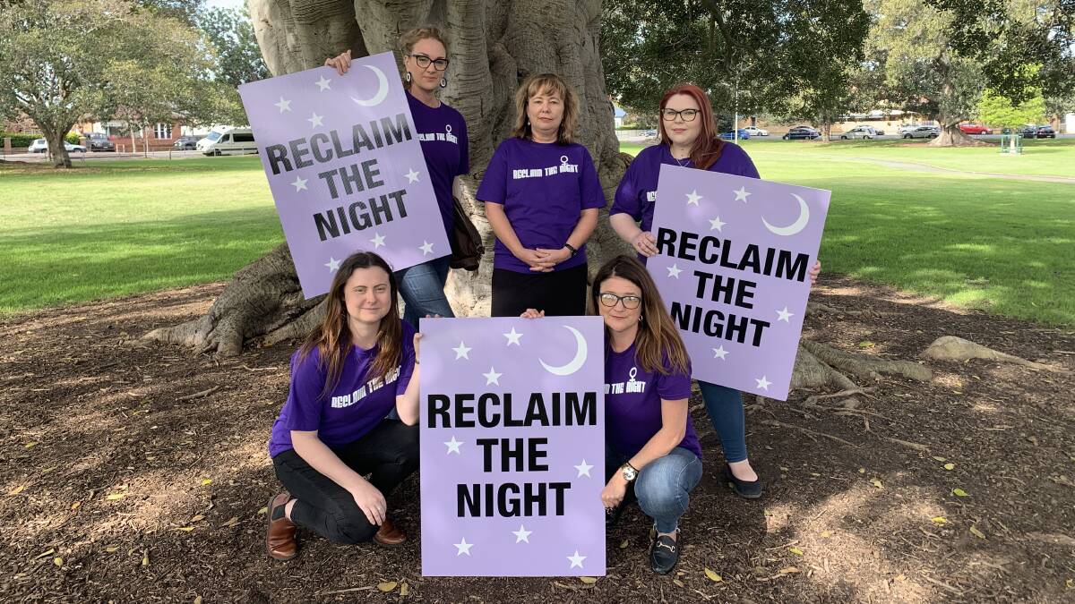 Meighan Jenkins and Roz Smee (back, from left) from the Newcastle Domestic Violence Committee with Reanna Cunningham and Chloe Hope (front, from left) from Carries Place and Louise Hawkins, also from the Newcastle DV committee, at Gregson Park, Hamilton.