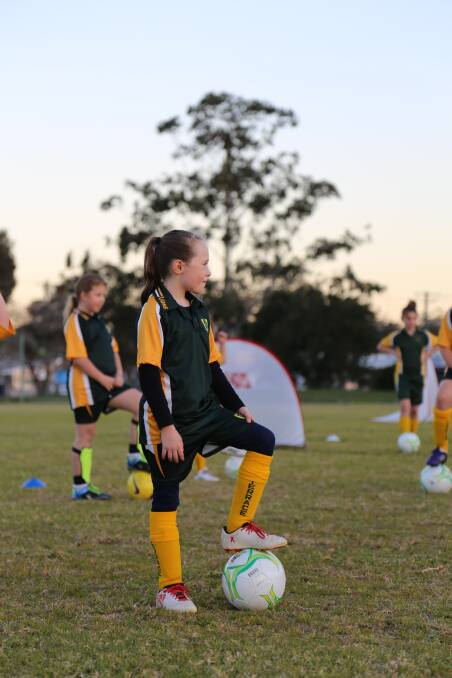 Northern NSW Football's female participation officer Holly Ayton, far right, with Raymond Terrace Soccer Club's mini roo girls (aged 6 to 11) in July 2018. Pictures: Ellie-Marie Watts
