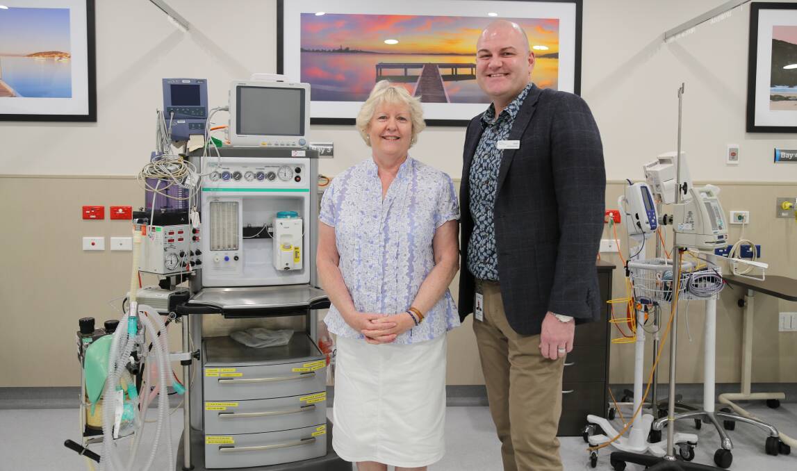 CHARITABLE: Operation Hope founder Erica Henley with Toronto Private Hospital CEO Jason Penberthy with one of the anaesthetic machine donations. Picture: Ellie-Marie Watts