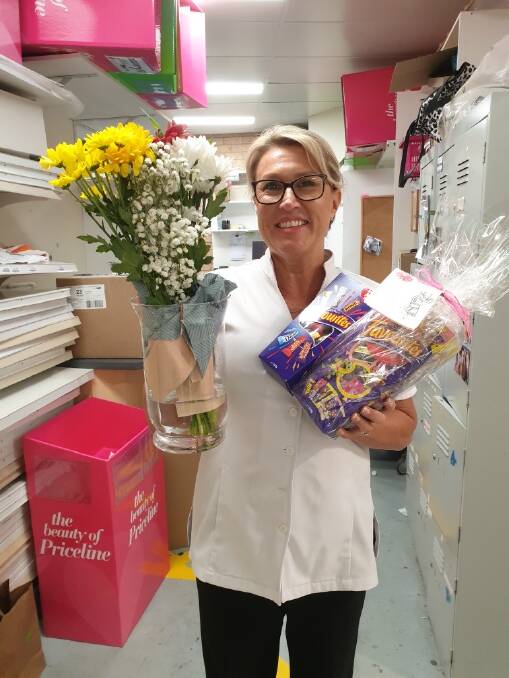Kiely Hindmarch with some of the flowers and chocolates sent to her and her staff following an altercation in April.