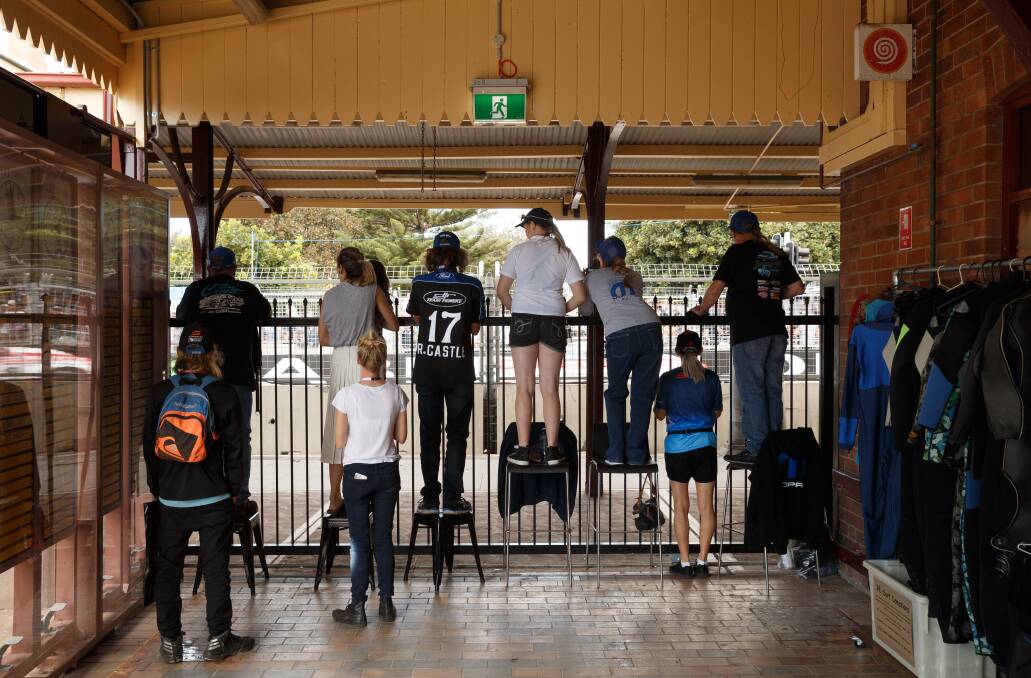 Spectators line the fence at the old Newcastle railway station on day two of the Newcastle 500 V8 Supercars in 2018. Picture: Max Mason-Hubers