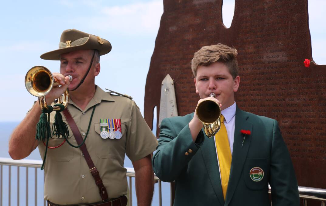 Australian Army Band Newcastle Major David Thompson with Blaine Stubbs, 17, from Newcastle Bugle Corps.