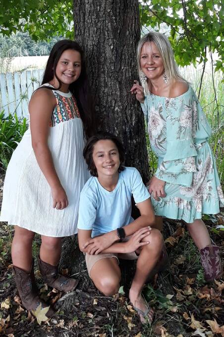 LOVING: Georgie, 12, Ollie, 14, and Kristen Calculli. Friends of Ms Calculli, who has terminal breast cancer, are seeking support from the community to help keep the Martinsville mother in her home.
