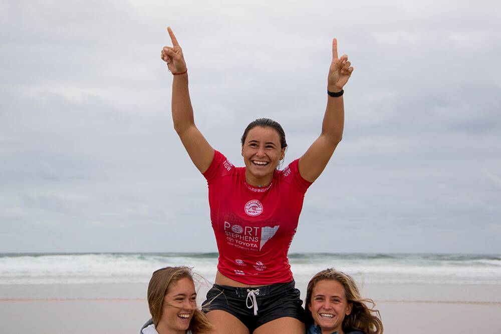Johanne Defay is lifted up out of the water after winning the Port Stephens Toyota NSW Pro Women’s QS6000. Picture: Ethan Smith / Surfing NSW