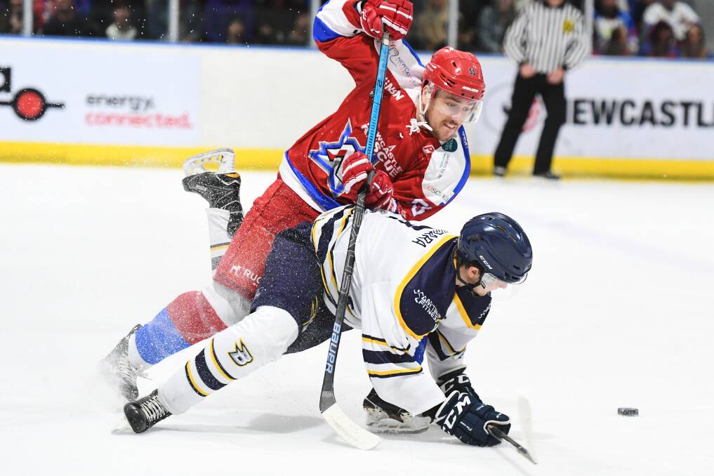 Richie Tesarik battles a CBR Brave player for the puck. Picture: PowerPlay Photographics