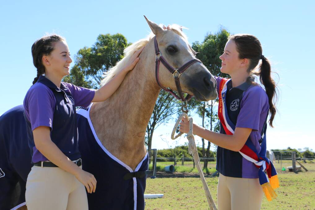 SKILLED: Salt Ash Pony Club members Alana Buresti, 19, and Abbey Lonsdale, 12, with Elmridge Roxy. The three did well at the 2018 NSW Pony Club State Showriding and Dressage Championships.