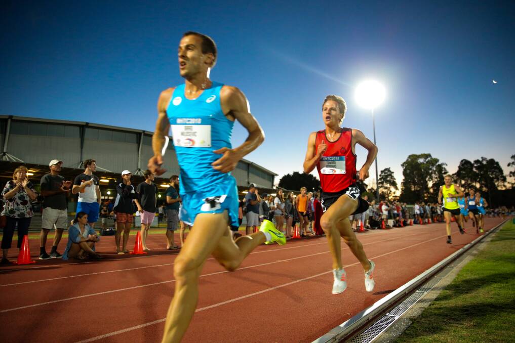 RUN: Edward Goddard chases down Brad Milosevic before going on to win the men's 5000m at the 2018 Hunter Track Classic. The classic returns on Friday, Janaury 25. Picture: Max Mason-Hubers 
