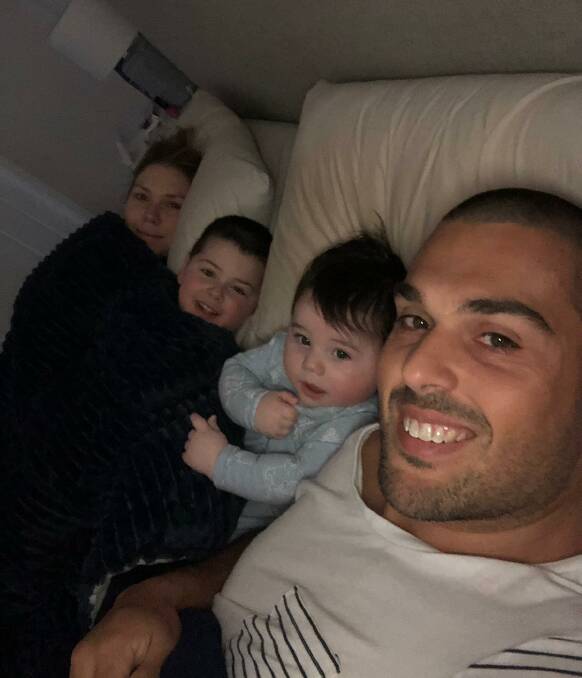 FAMILY: Alanna and Chris Poulos, 29 and 32, with their sons Hunter, 3, and Tyson, nine months, before Mr Poulos' accident two weeks ago. Picture: Supplied
