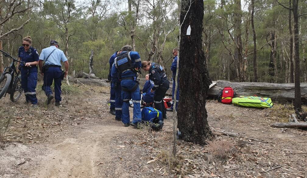 HELP: Emergency services personnel attend to Owen Walton after his crash. Picture: Courtesy, Anne Moore 