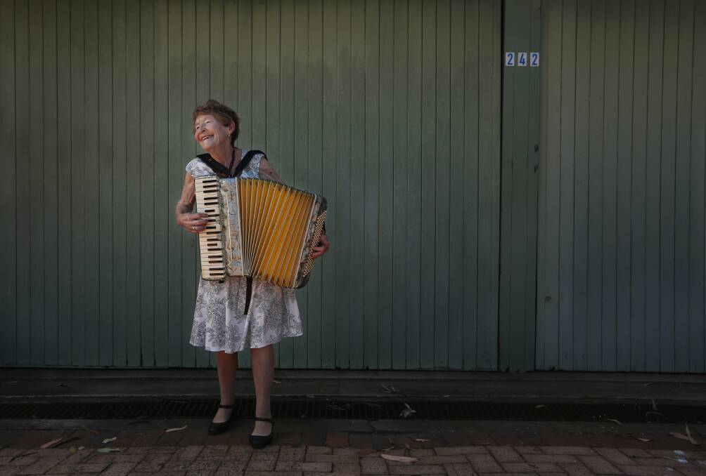 Long-time volunteer musician Margaret McNaughton playing her accordion. Picture: Simone De Peak