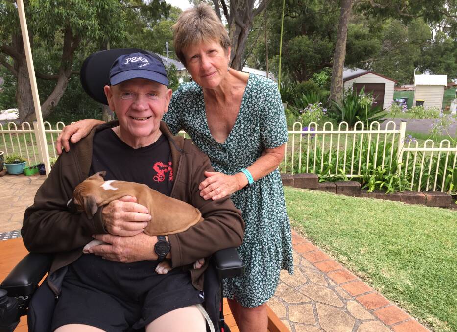 Owen Walton and Anne Moore, with Bella the companion dog, at their Wangi Wangi home. 