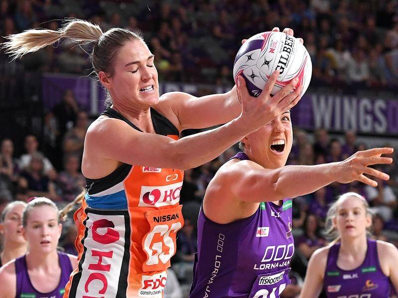Caitlin Bassett of the Giants (left) will lead a new-look Diamonds team at the Netball World Cup.