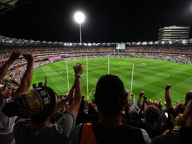 Fans enjoy the historic AFL grand final that was played at the Gabba.