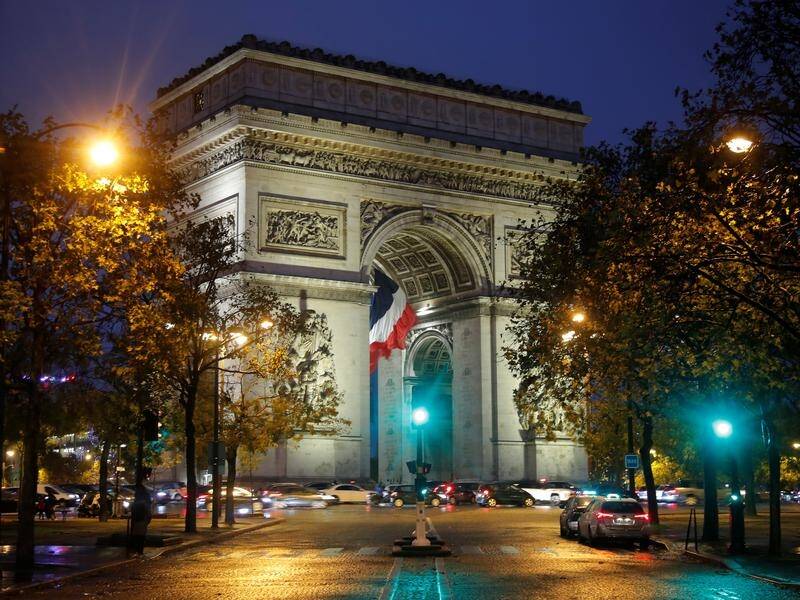 Areas around the Arc de Triomphe and Eiffel Tower were evacuated after a bomb alert, police say.