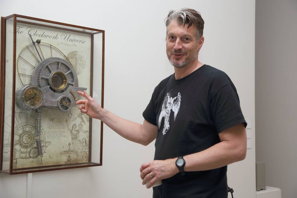 Rob Cleworth with his favourite piece from the Antipodean Steampunk collection, The Clockwork Universie.
