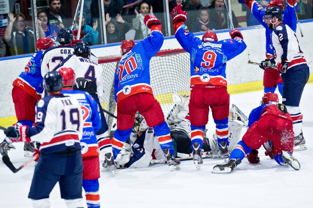 LAST GASP: Newcastle North Stars' Chris Wilson shoots a game-winning goal against Perth Thunder on Saturday to keep the team's finals hopes alive.