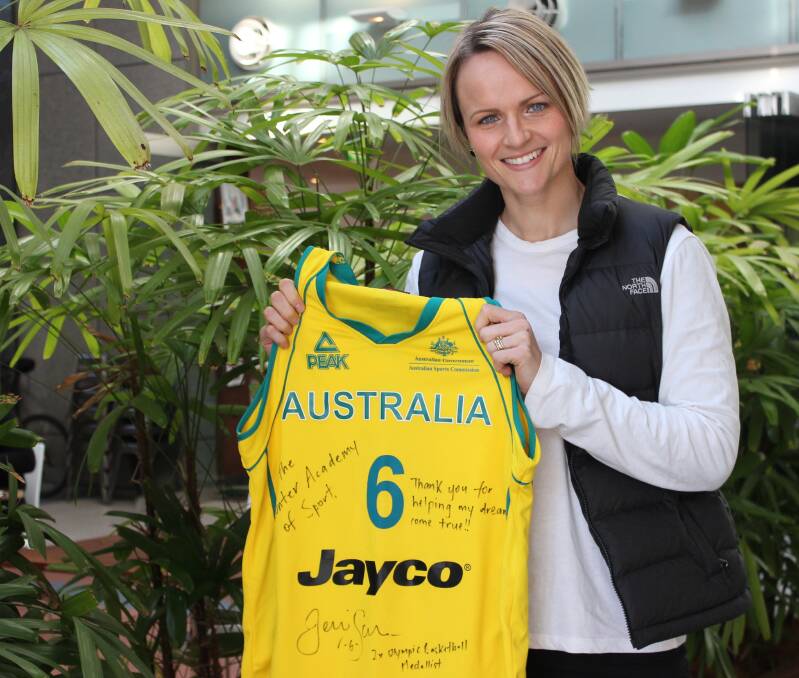 BALLER: World champion basketballer Jennifer Screen with one of the autographed shirts she presented to the Hunter Academy of Sport and Greater Building Society.