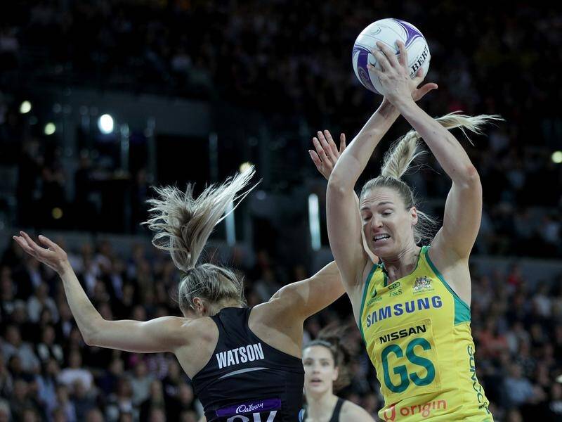 Australia's Caitlin Bassett beats NZ's Jane Watson to the ball during the second netball Test.