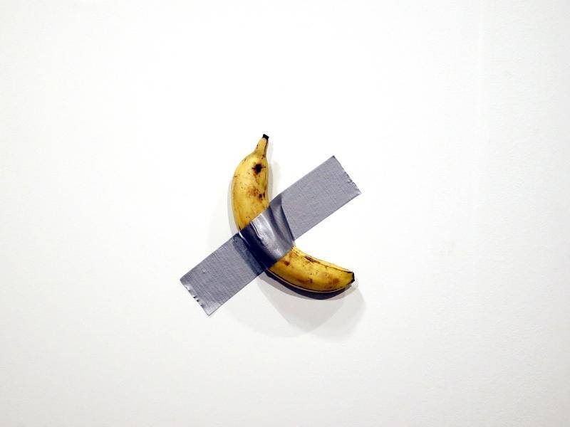 A banana duct taped to the wall has sold for $A175,000 at Art Basel in Miami, Florida.