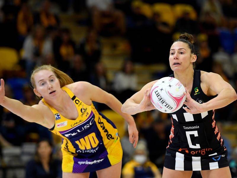 Collingwood's Madi Browne (r) requires more knee surgery, forcing her to call time on Super Netball.