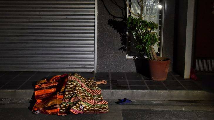 One of two people killed in a double shooting in the Manila suburb of Baclaran, lies in the street.  Photo: Kate Geraghty