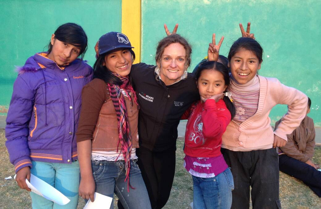 NEW HEIGHTS: Hamilton South resident Sonja Duncan in Peru with girls from Los Nogales school, Cusco, during the GirlSportWorks program.