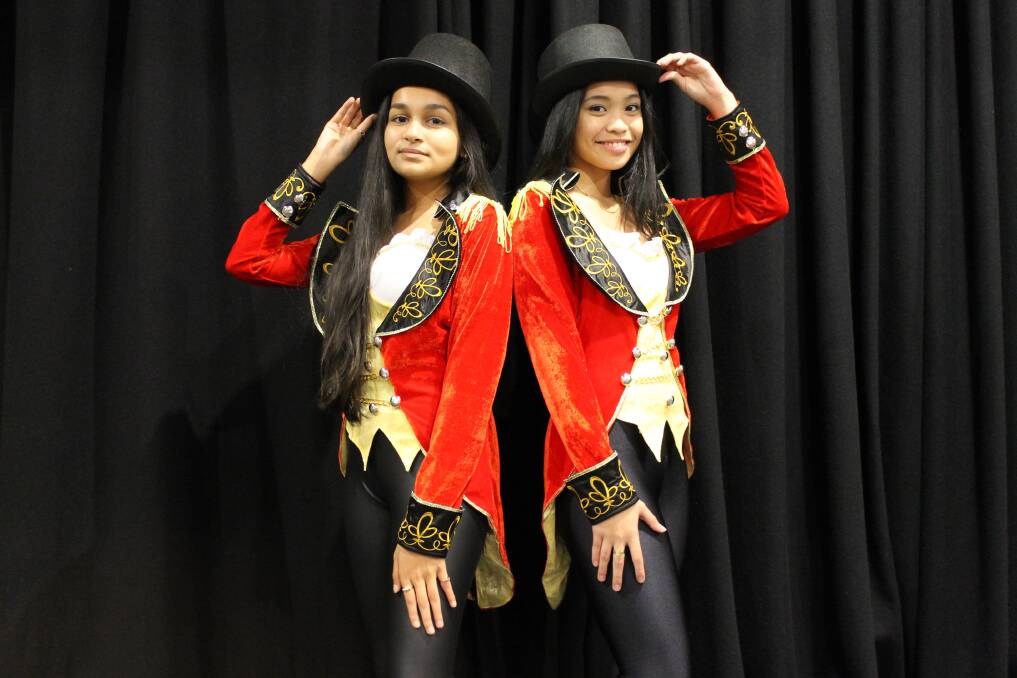 COMMANDING: Fabihah Siddique, 15, and Jamie Razon, 16, wearing their ringmaster costumes for the Star Struck 2014 opening act.