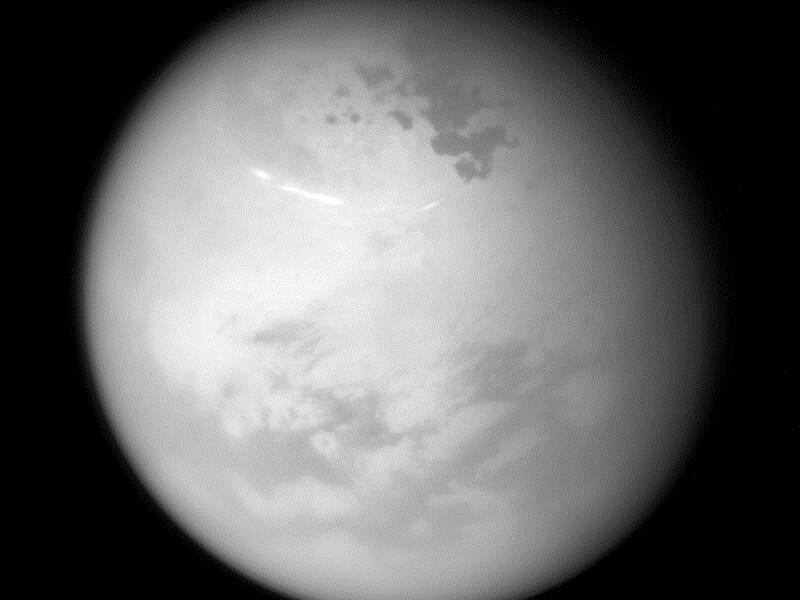 A NASA image showing bright methane clouds drifting in the summer skies of Saturn's moon Titan